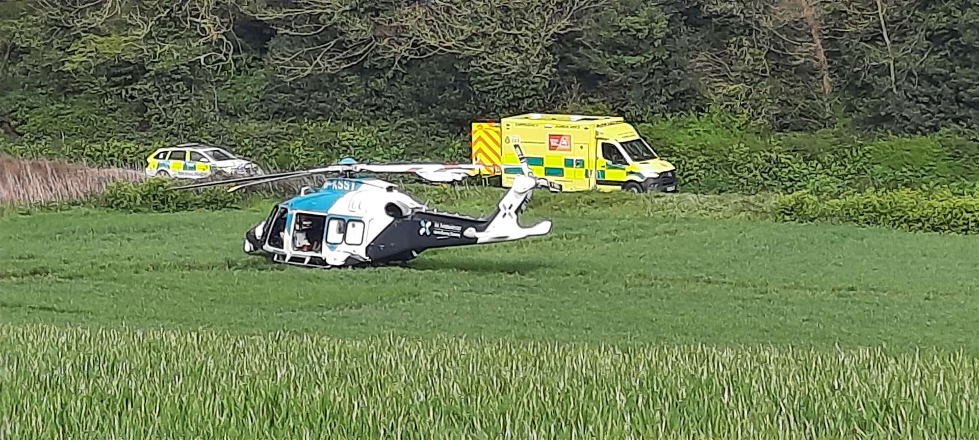The air ambulance was seen landing in a field near the accident. Picture: Val Swallow