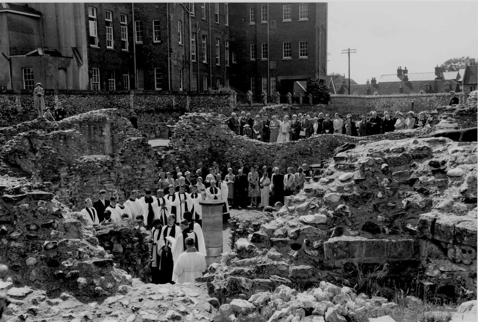 The end-of-term service at St Augustine's College, Canterbury, in June 1960, was held in the Abbey ruins. Priest-students from all parts of the world took part. Note the former Kent and Canterbury Hospital building in Longport looming up behind. St Augustine's was then the central training college for the Anglican communion