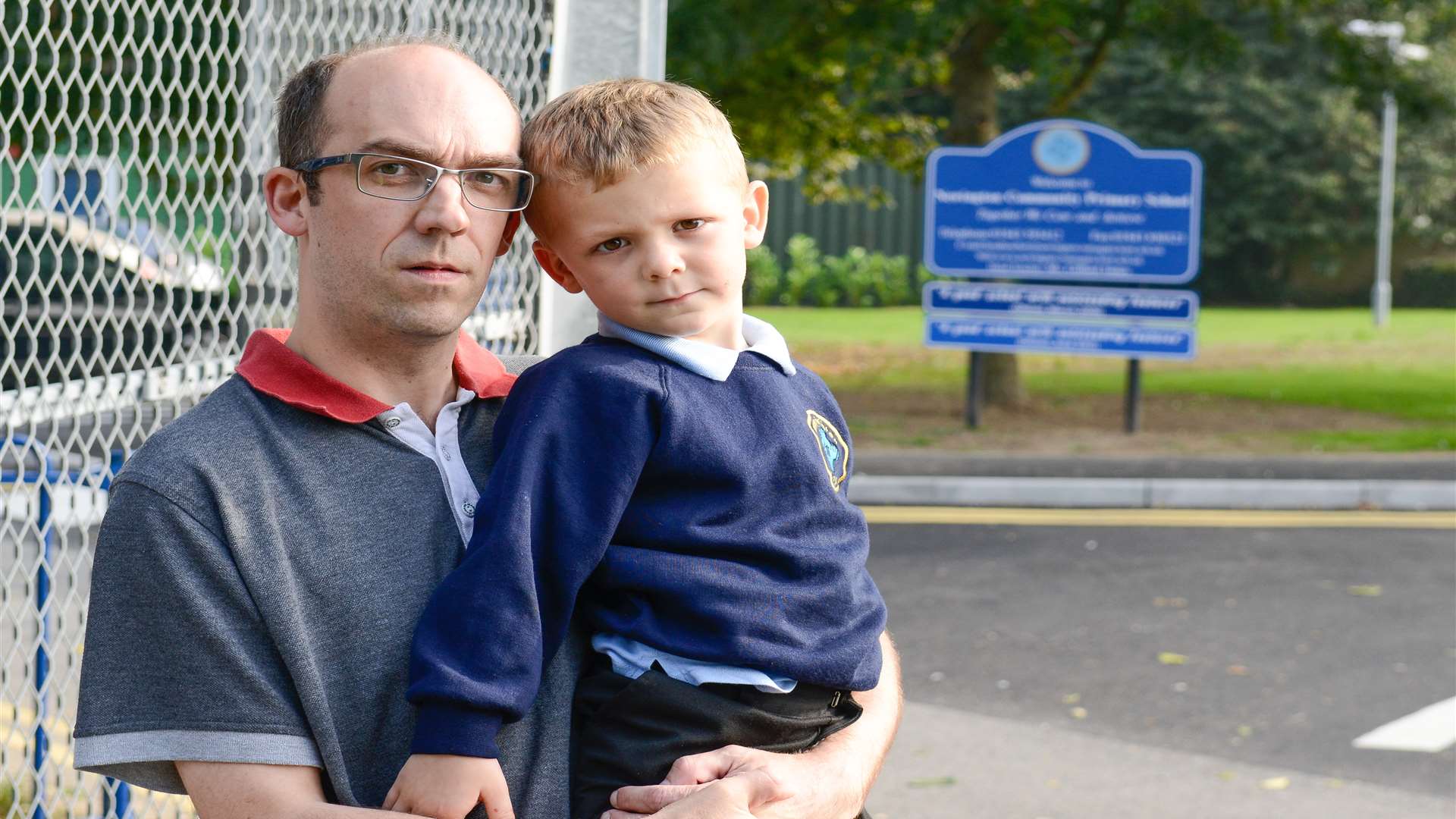 Jensen Hart with his father outside his new school