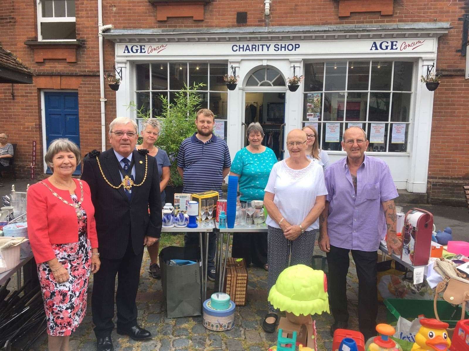 The Mayor and Mayoress of Sandwich Cllr Paul and Sue Graeme join charity shop manager Dan Friend and his team to mark the reopening