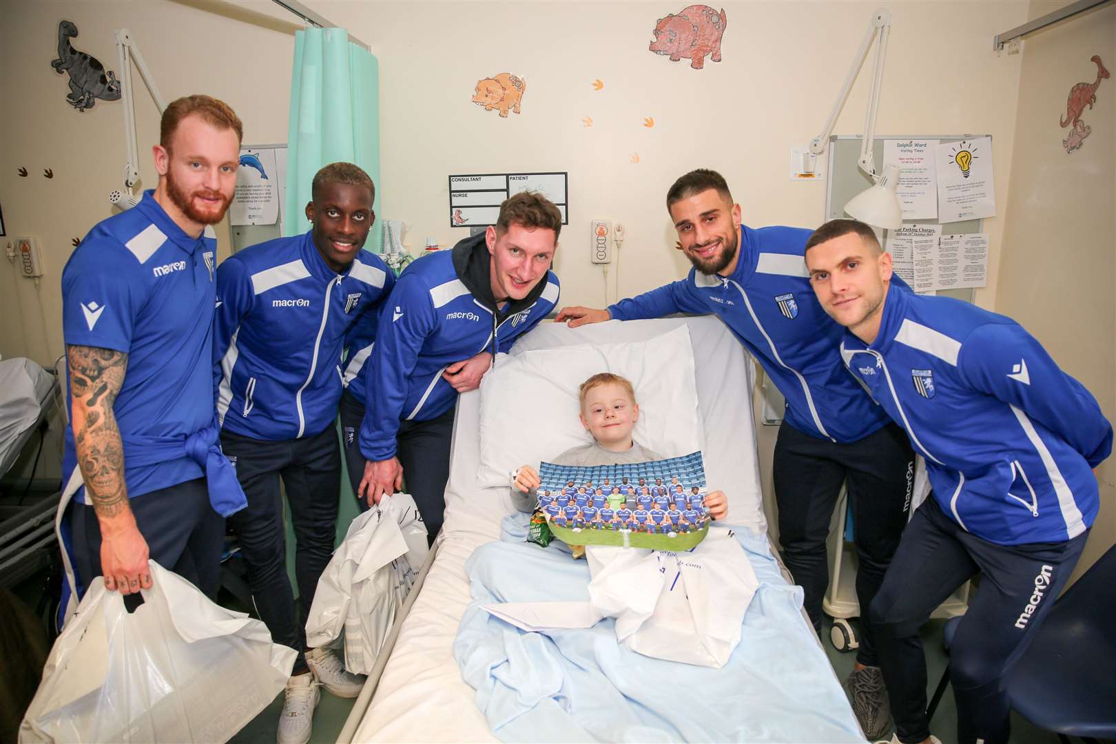 Stuart O'Keefe helped spread a bit of festive cheer at Medway Maritime Hospital during the team's visit to the children's Dolphin Ward. Pictured with seven-year-old Jack Fordham.