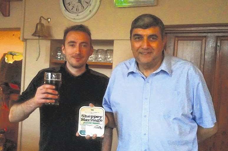 Chris Roberts and Melvin Hopper with a pint of Sheppey Heritage
