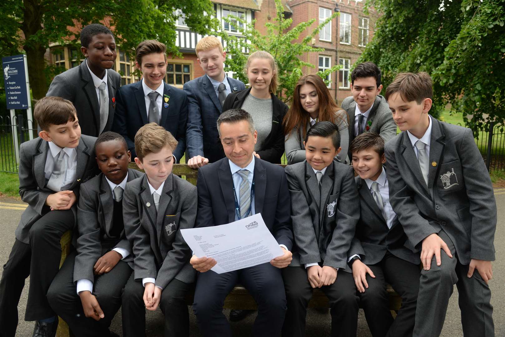Executive principal Gwynn Bassan and some of his pupils at Holcombe Grammar School