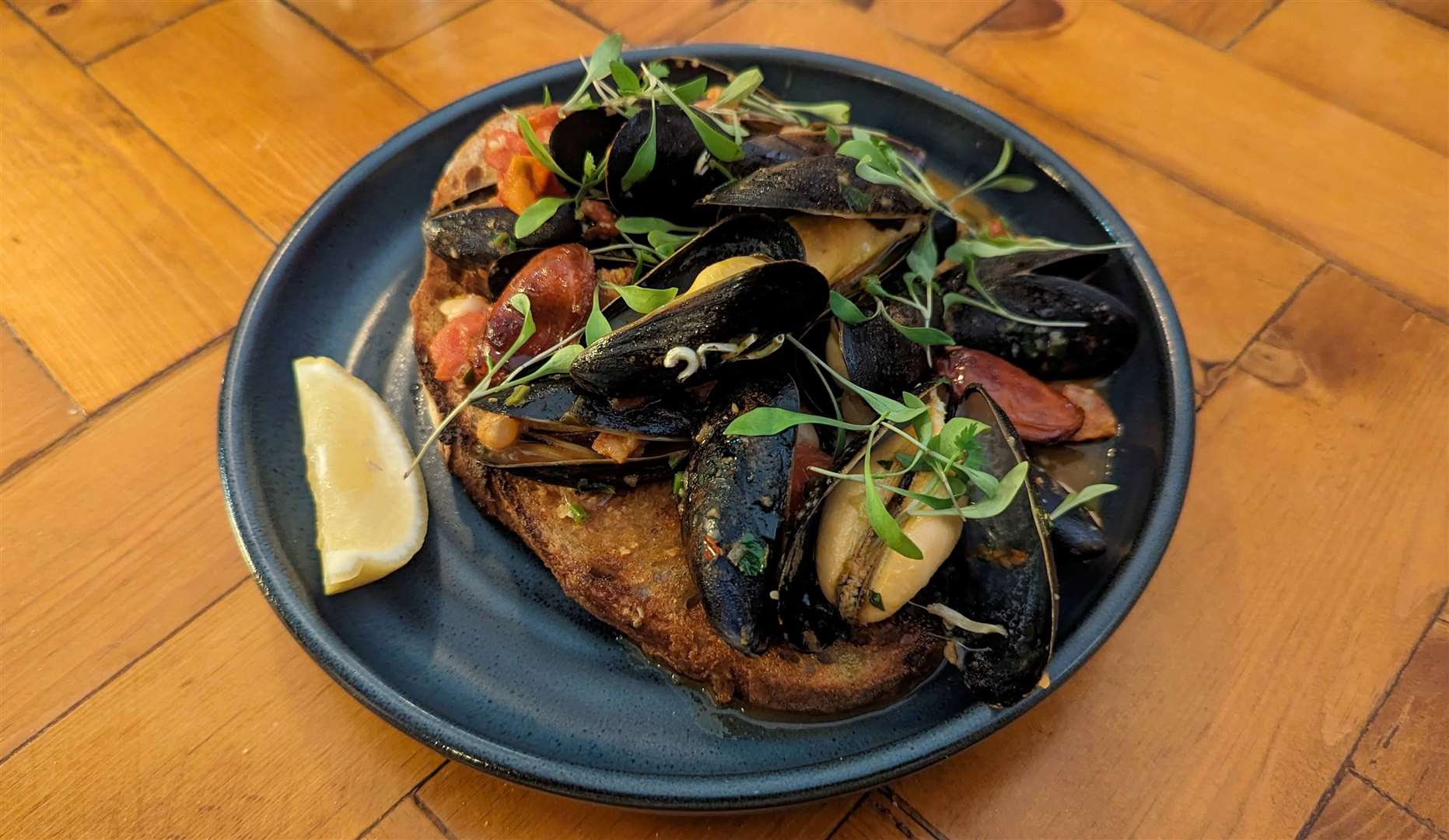 Mussels, butter beans and chorizo on toast
