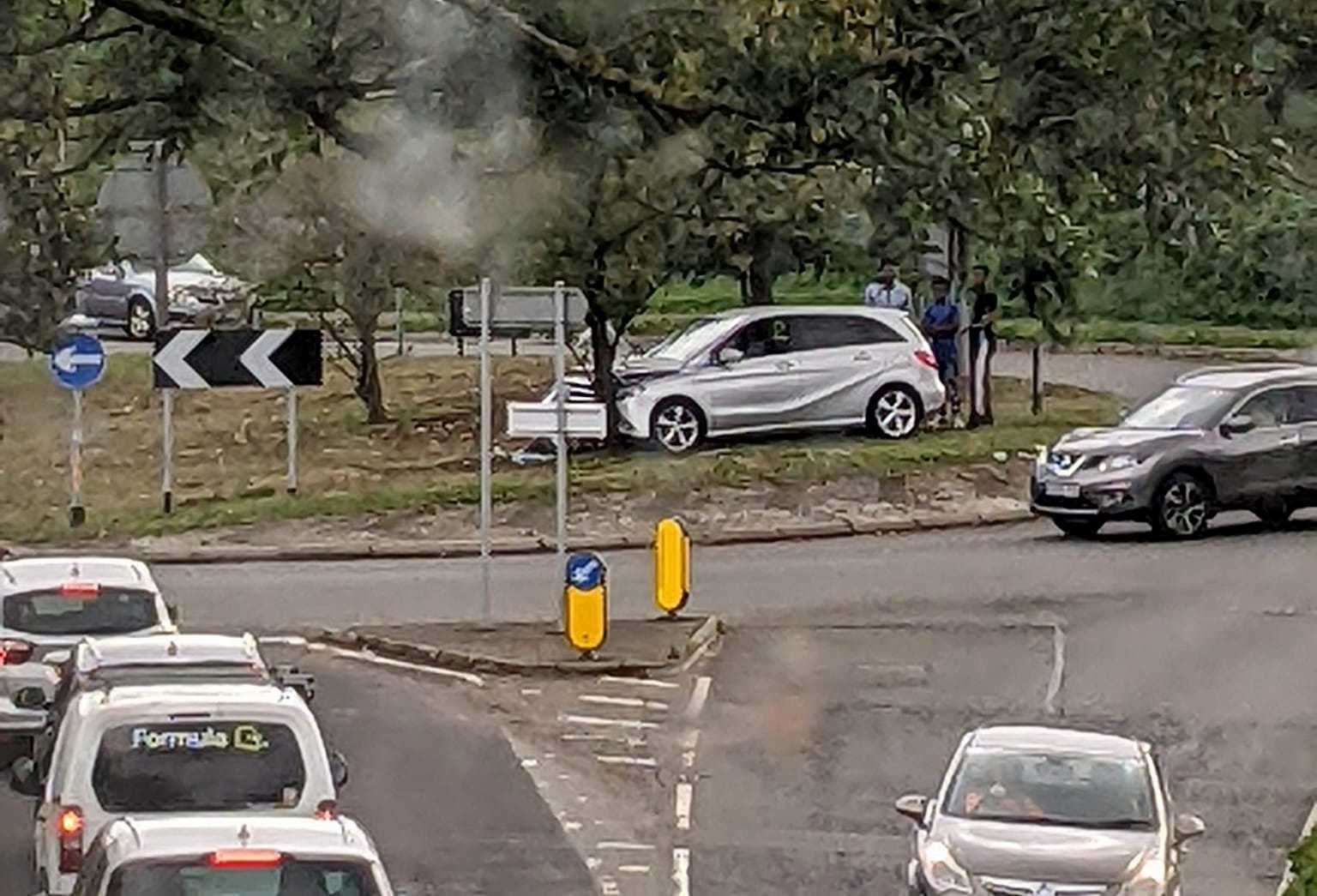 The silver Mercedes crashed on top of the roundabout in Hawkinge this morning. Picture: Sean Vincent