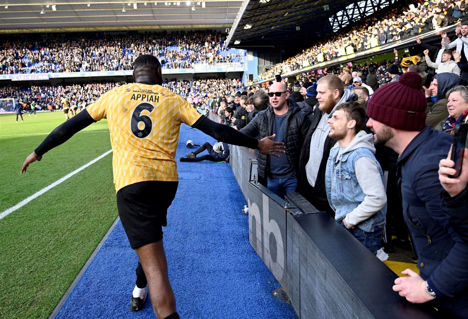 Paul Appiah celebrates with the Maidstone fans at Portman Road. Picture: Barry Goodwin