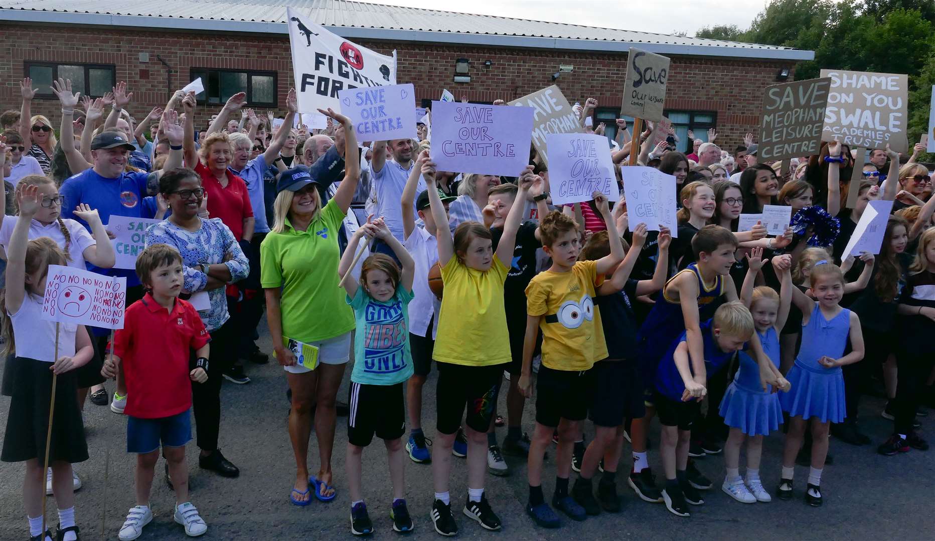 School children joined in the protests and waved placards and posters at Meopham Leisure Centre. Photo: Anna Roberts