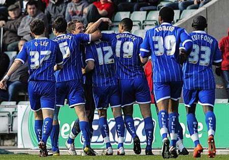 Gillingham players celebrate Joe Martin's first half goal in the 1-0 win at Plymouth Argyle