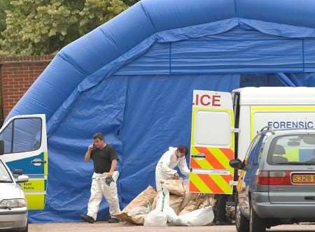 A police forensics team at the spot where the body was found. Picture: GARY BROWNE