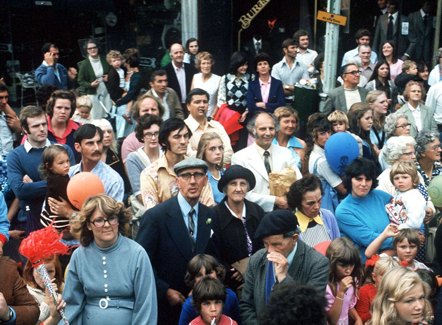 Crowds watching the Ashford Carnival procession through the town centre in 1975. Picture: Tam Fox