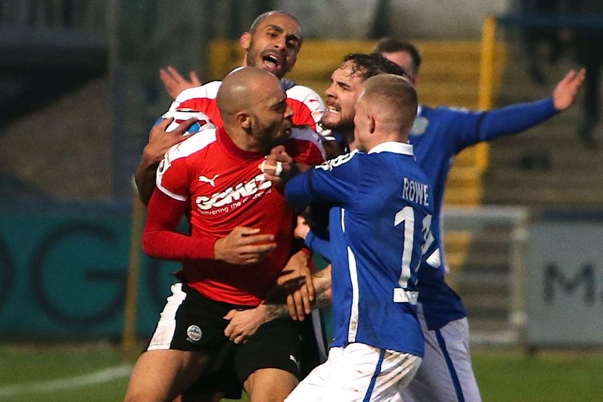 Richard Orlu saw red for his part in this tussle. Picture: Peter Hilton