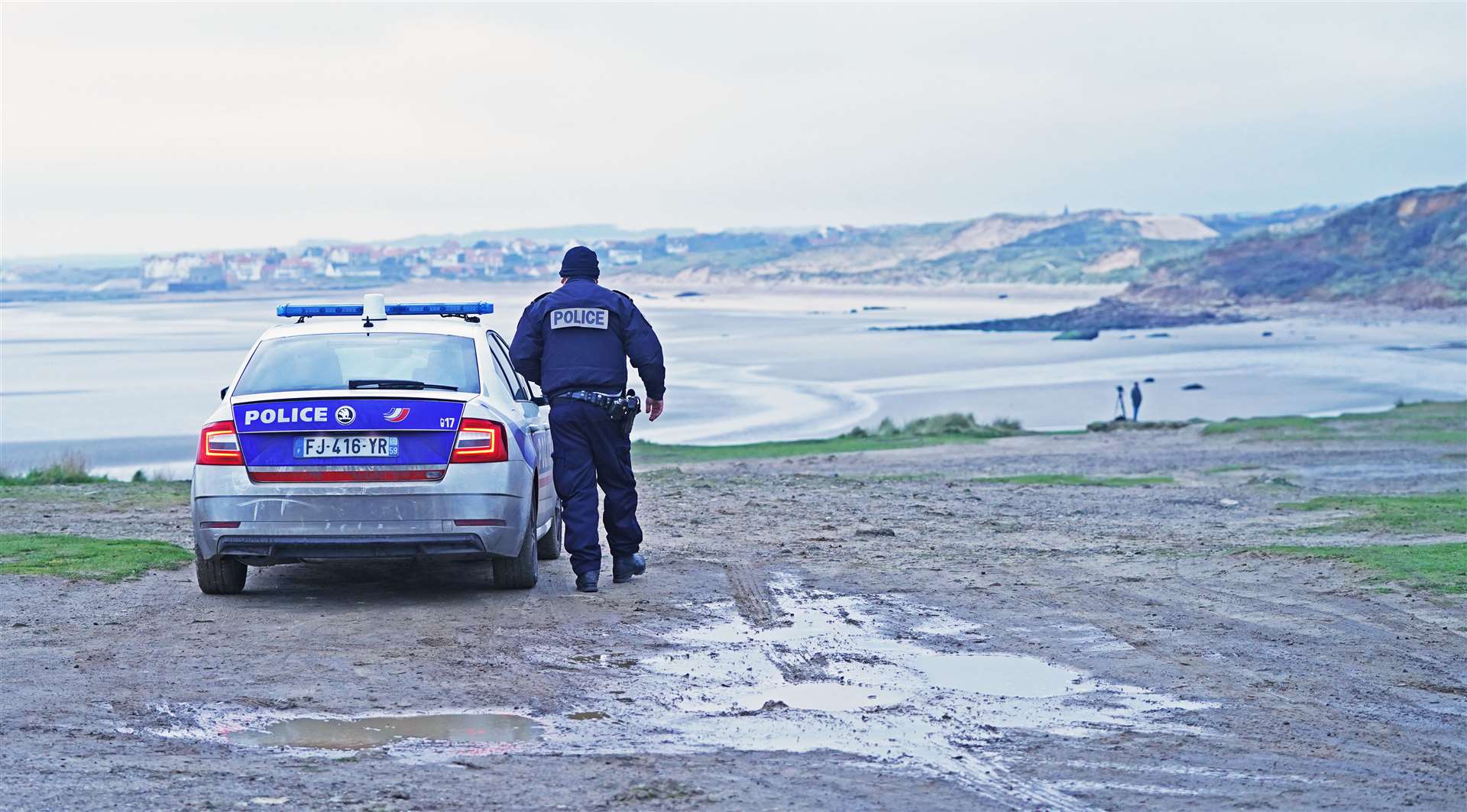 French police look out over the coast at Wimereux, north of Boulogne, at a stretch of beach believed to be used by migrants seeking to cross the English Channel (Stefan Rousseau/PA)