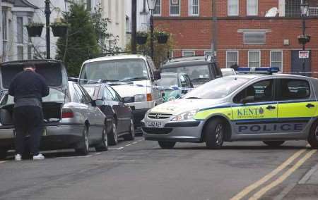 Police at the scene of the stabbing. Picture: Ben Hollingbery