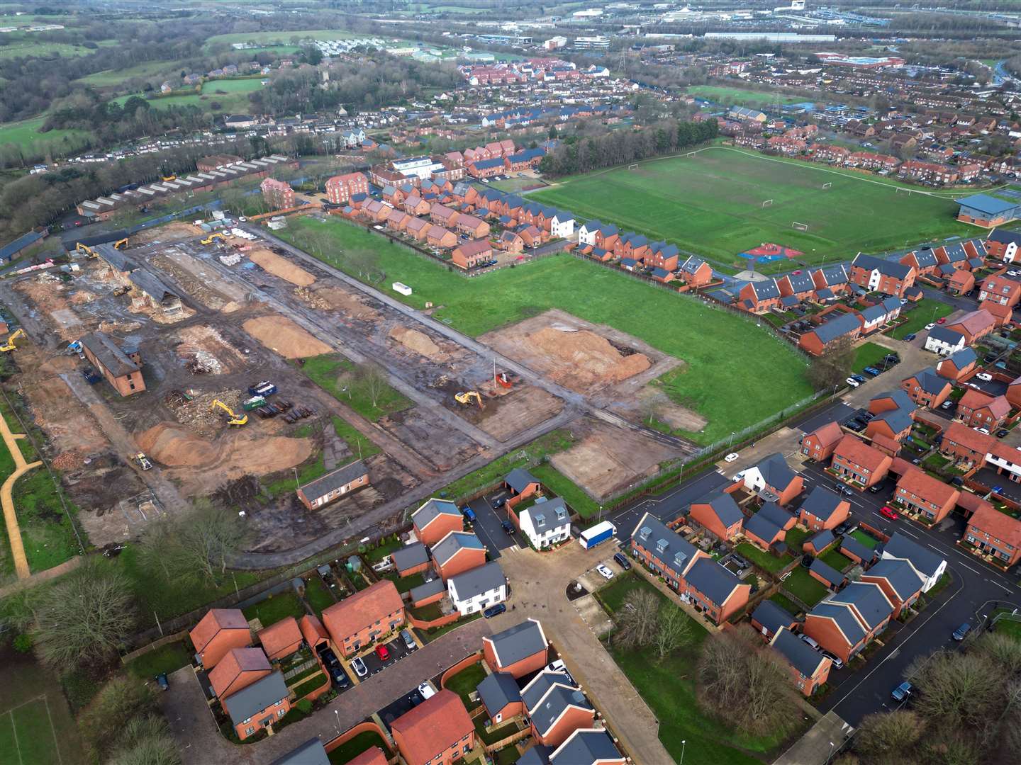 New homes at The Stadium can be seen in the foreground and alongside the football pitches. The Officers' Mess homes can be seen at the top of the picture. The demolition of Risborough Barracks can be seen on the left. Picture: Barry Goodwin