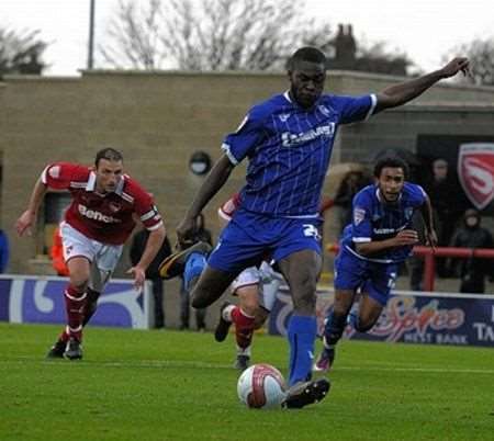 Frank Nouble steps up to score Gillingham's consolation from the penalty spot