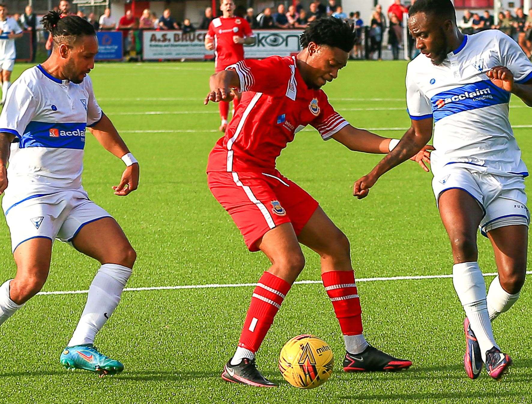 Stephen Okoh takes on two Erith players. Picture: Les Biggs