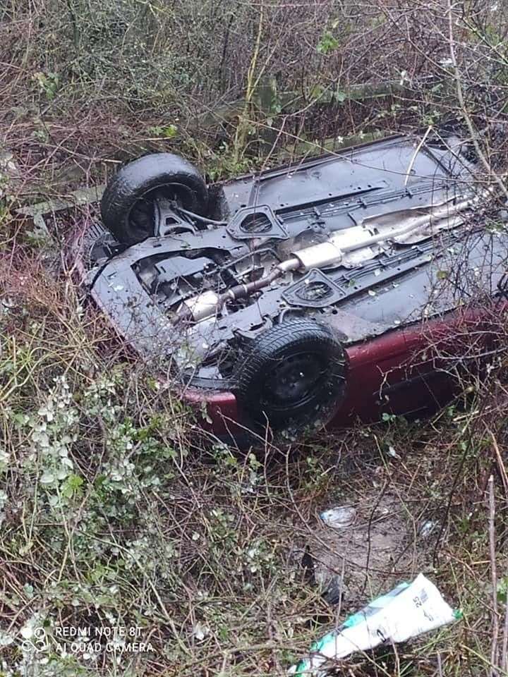 The car flipped onto its roof after hitting a piece of black ice