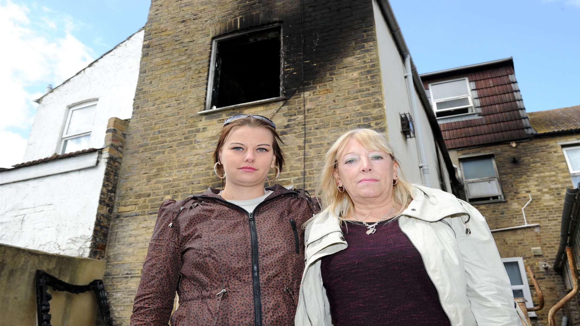 Sandra Lawson with her daughter Adele at John's Lawson's flat - which was badly damaged in a fire