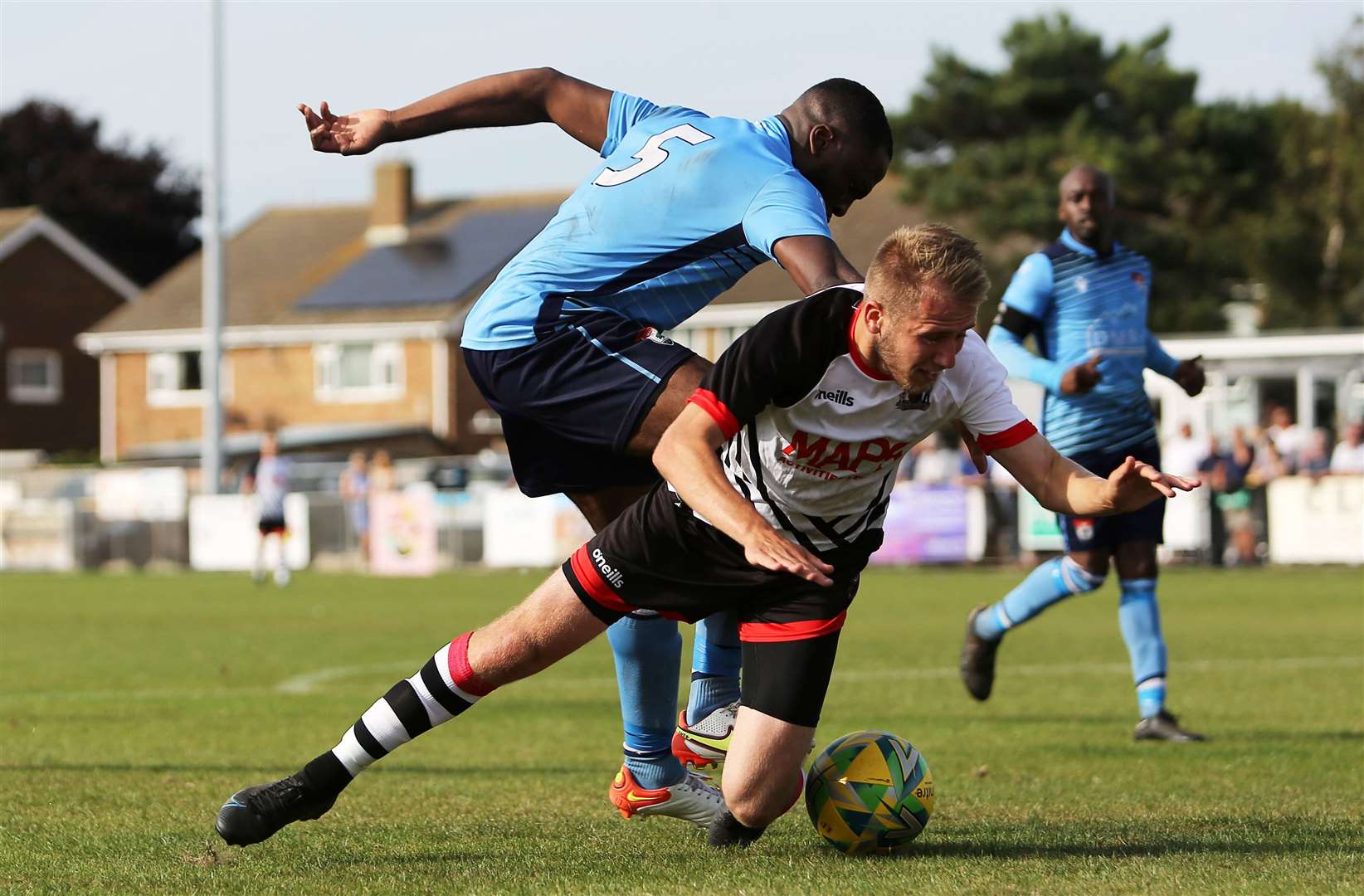 Deal's Joe Reeves is challenged by Bode Olajide of Lordswood. Picture: Paul Willmott