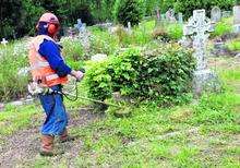 Offenders on Community Payback help to improve the graveyard at St Peter's Church