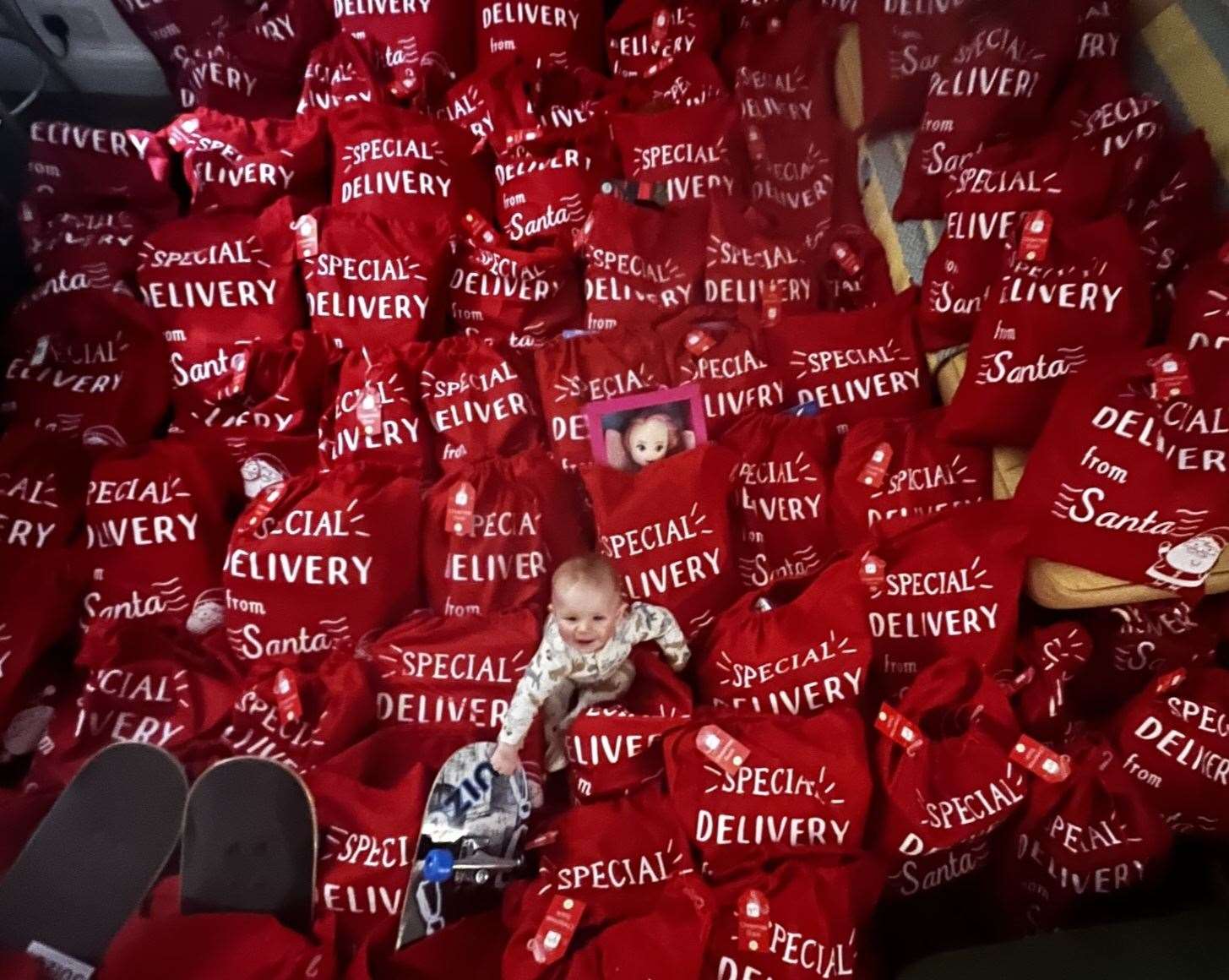 Cia Merrall's baby Fin has been helping get 100 Christmas stockings ready to deliver to children in need