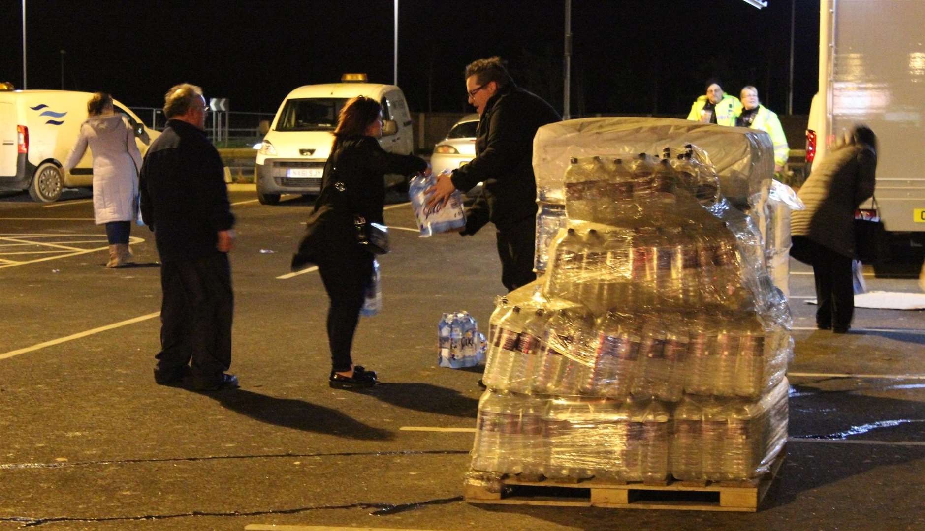Cllr Cameron Beart helped hand out supplies of bottled water at Morrisons, Sheppey, in Ja nuary 2016 (1388812)