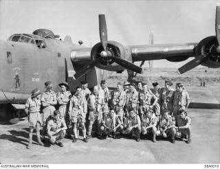 John Waye and fellow crew members of his Liberator bomber. He is second from the left in the front row.