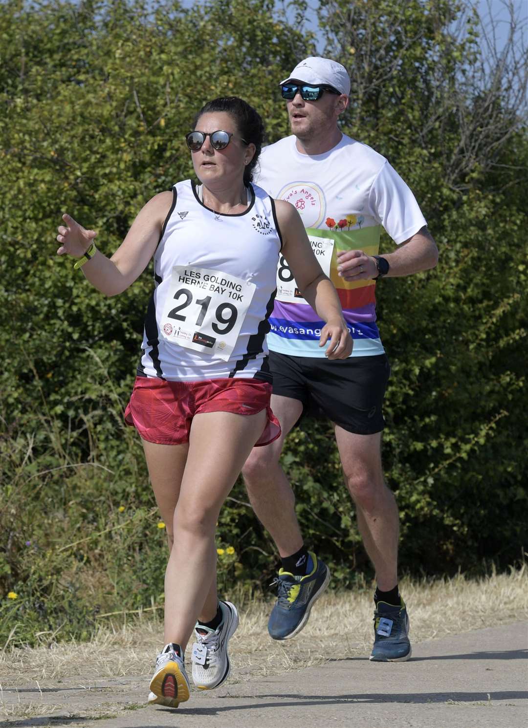 Amy Stimpson of Dover RoadRunners reaches out for a drink at a water station. Picture: Barry Goodwin (58030682)