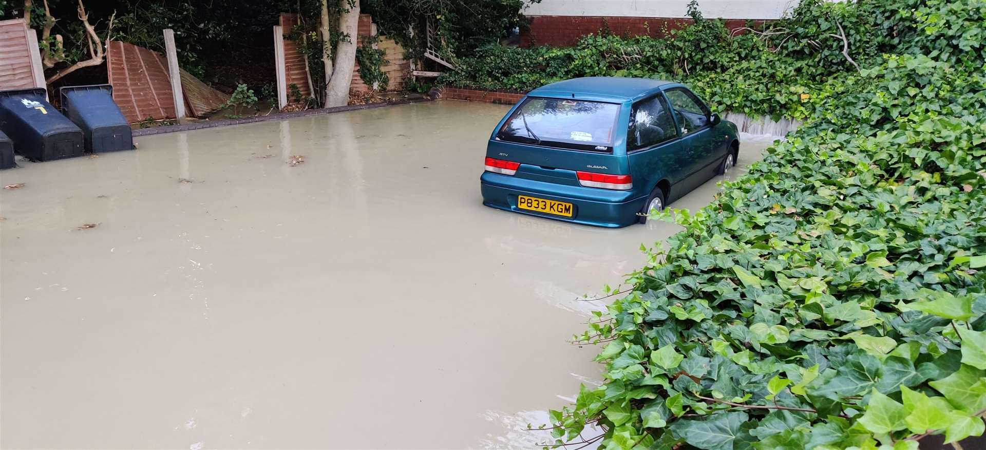 Murky water flooded the ground-floor flats in Cherry Garden Road