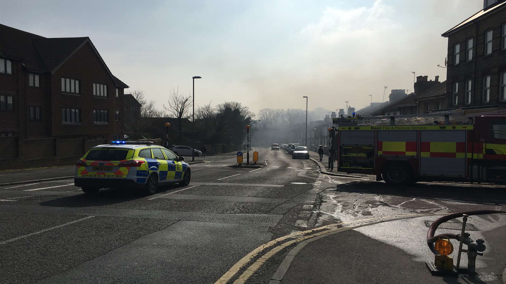 Smoke is drifting across the road and filling the air around the scene. Picture: Beccy Pollard