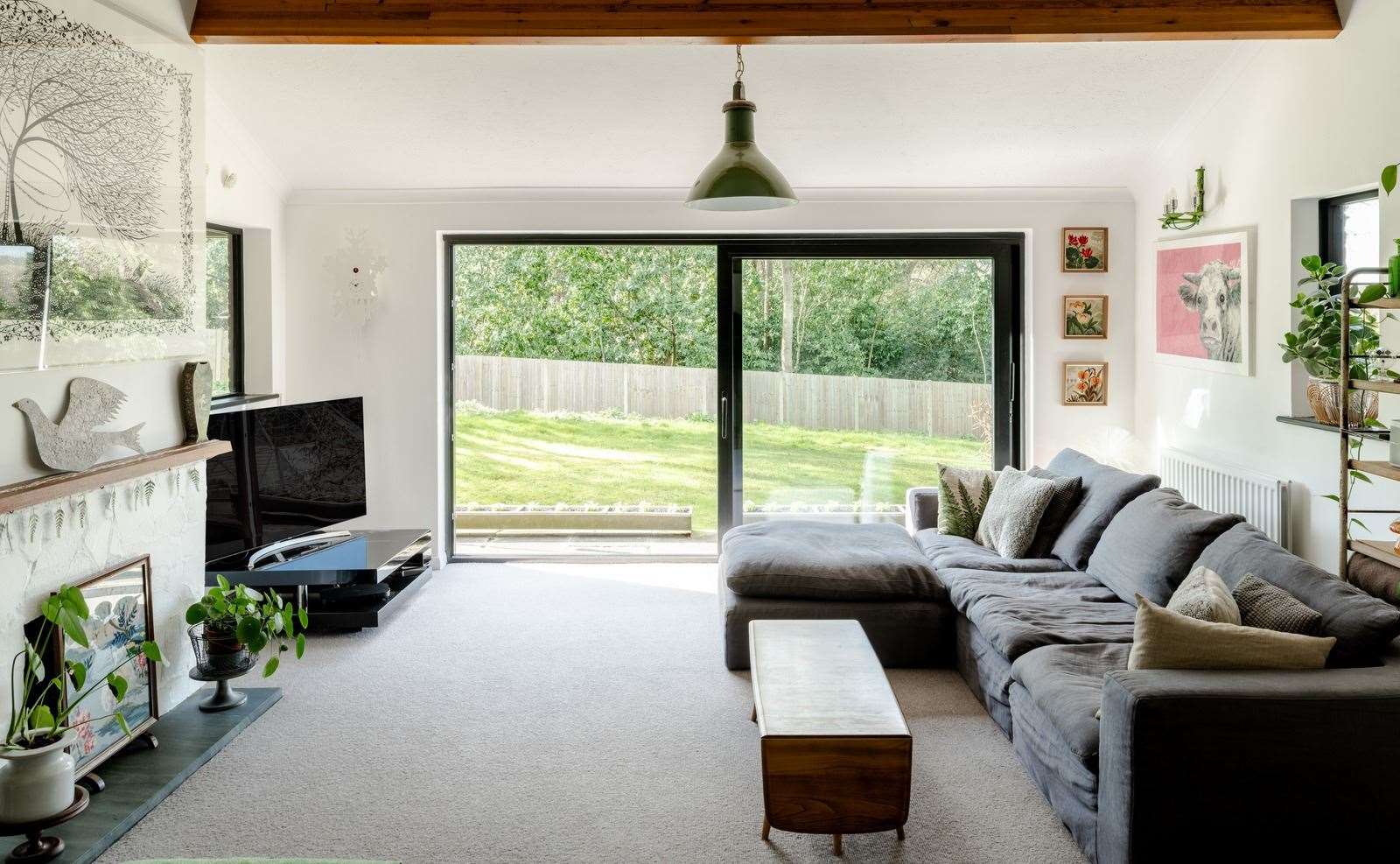 The owners have tried to create a more relaxed, casual vibe in the spacious sitting room. Picture: The Modern House