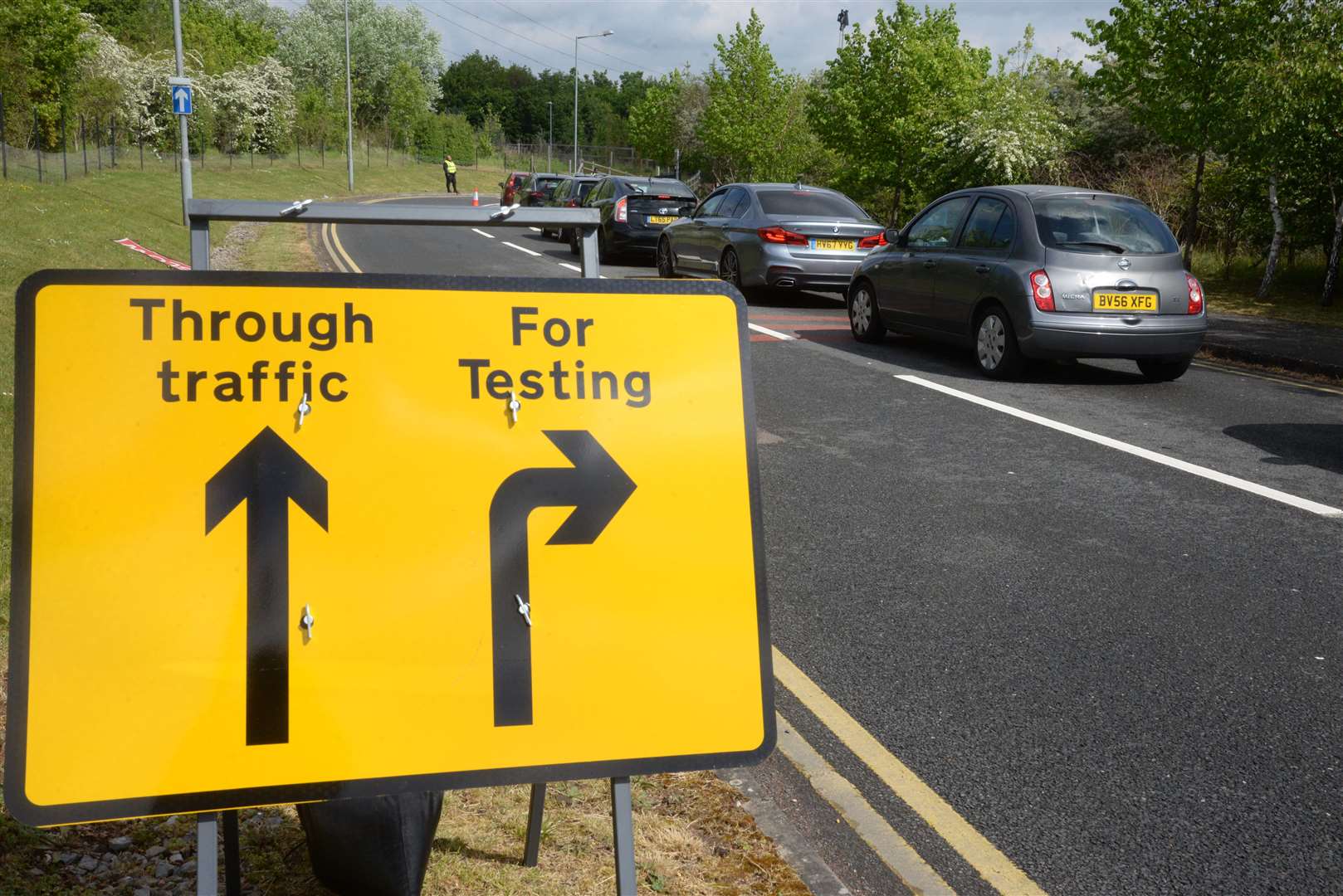 Vehicles queue to enter the Coronavirus testing centre set up in one of the car parks at Ebbsfleet International. Picture: Chris Davey