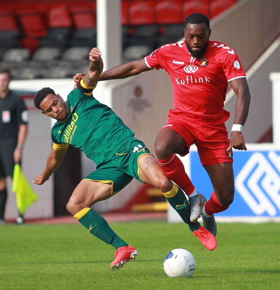Gozie Ugwu challenges Notts County's Nathan Tyson Picture: John Westhrop