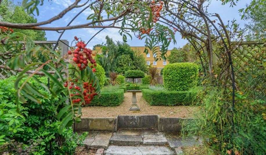 The walled garden is a beautiful setting for outdoor entertaining. Picture: Fine and Country