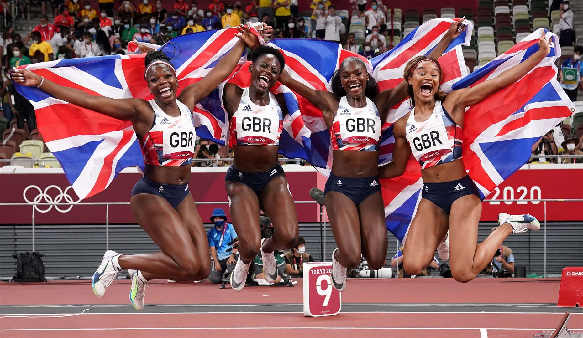 Dina Asher-Smith, second from right, won bronze at the Tokyo Olympics in the 4x100m replay. Picture: PA Wire