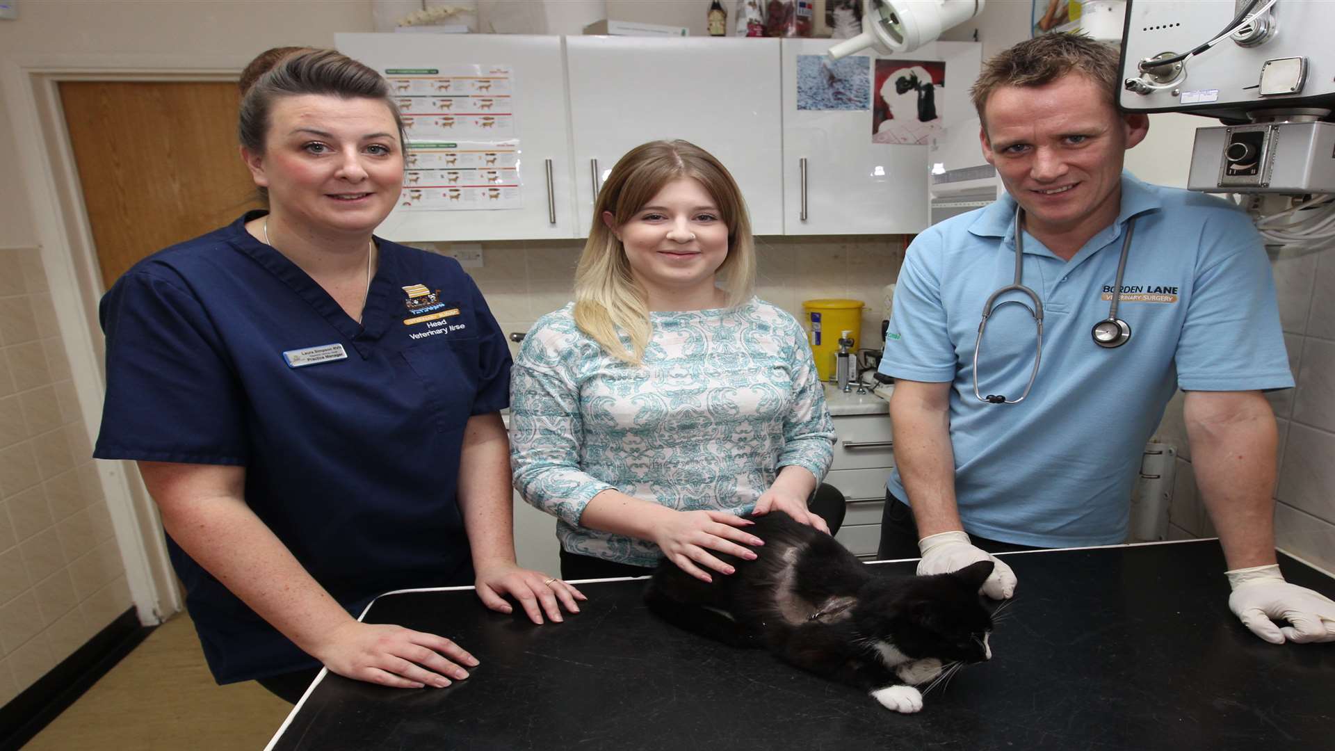 Laura Simpson, Practice Manager with Chloe Jessica Kirk, cat's owner and Ewen Bennett, Vet with Otis.