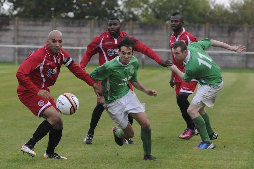 Ashford (green) on their way to victory over Greenwich in the first round
