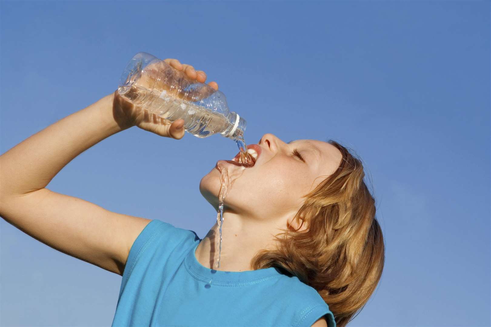 Drink plenty of water as the temperatures soar. Stock image
