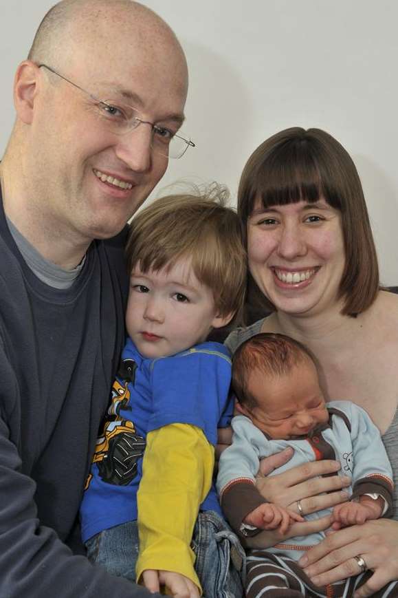 Dave and Susan Cooper with sons Michael, three, and newborn Sam