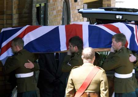L Cpl James Johnson's coffin is carried into the crematorium by fellow soldiers. Picture: Barry Duffield