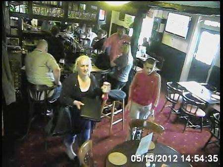 The woman steals the money from a collection tin at the Ship Inn, Dartford