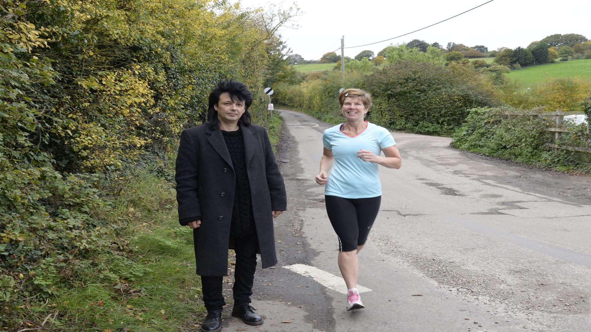 Cllr Mike Baldock and jogger Wendy Esler in Munsgore Lane, Oad Street.
