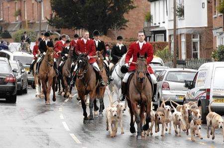 The scene in Elham as the East Foxhounds Hunt arrives in the High Street on Boxing Day.