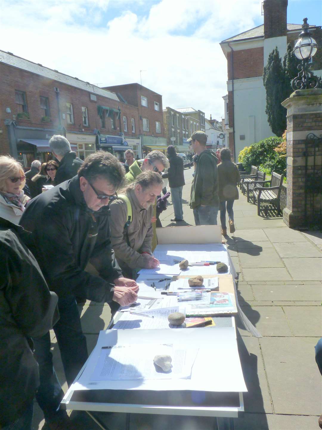 Members of the public in Deal sign the petition