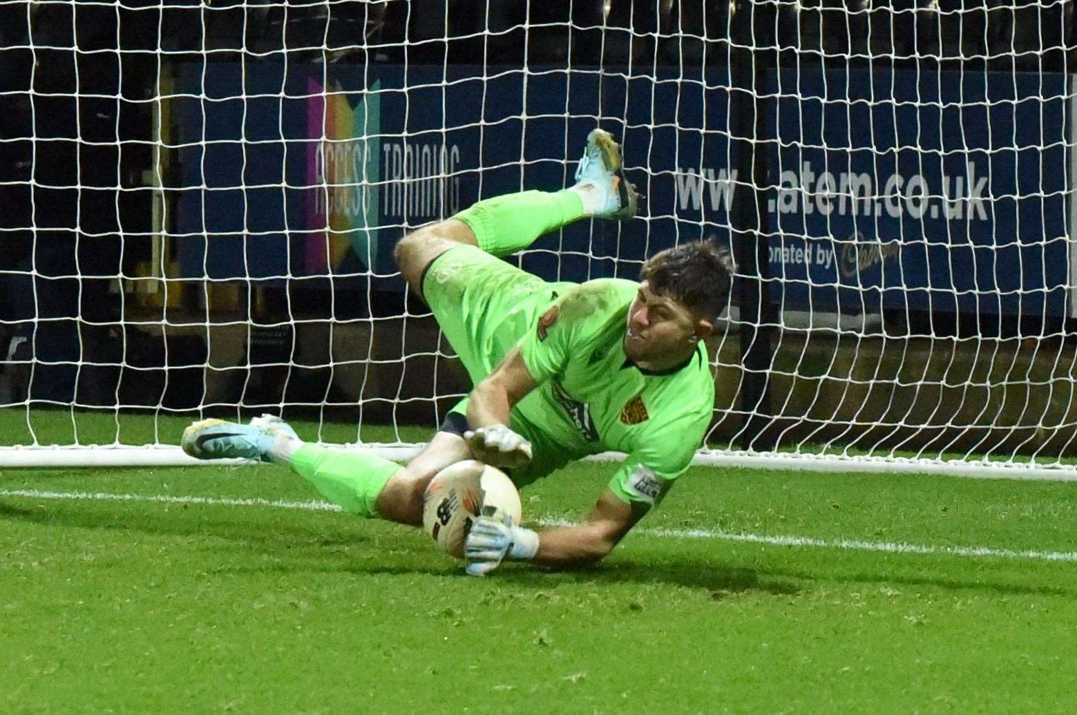 Tom Hadler makes the winning penalty save at Notts County. Picture: Steve Terrell