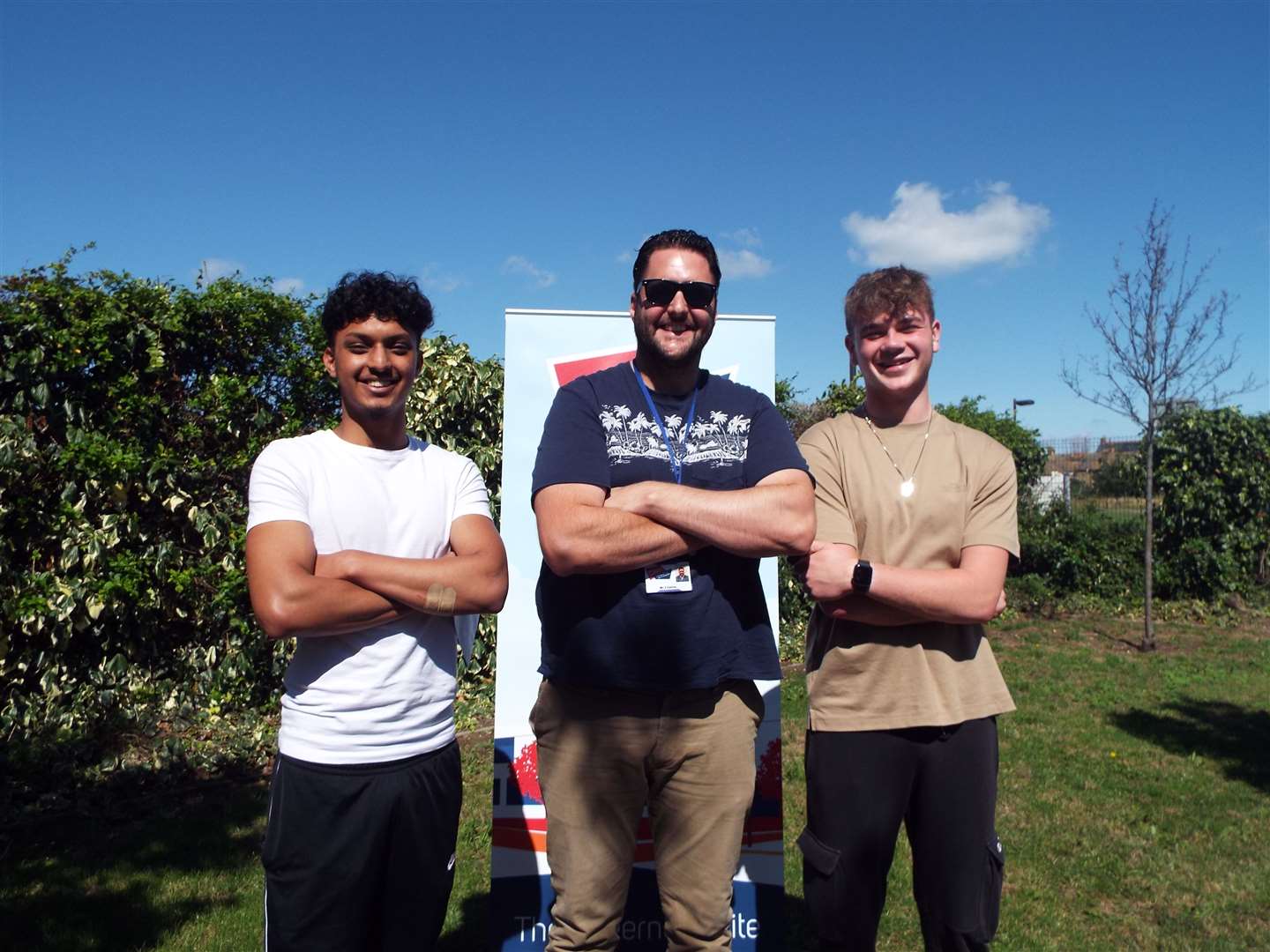 Best friends Shax Islam and Vinnie Palmer, pictured with teacher Stevielee Cairn, are heading to Brighton to study business management and finance after getting their results at the oasis Academy, Sheppey
