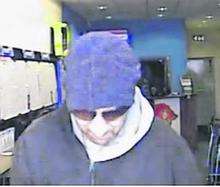 CCTV image of Coral robber