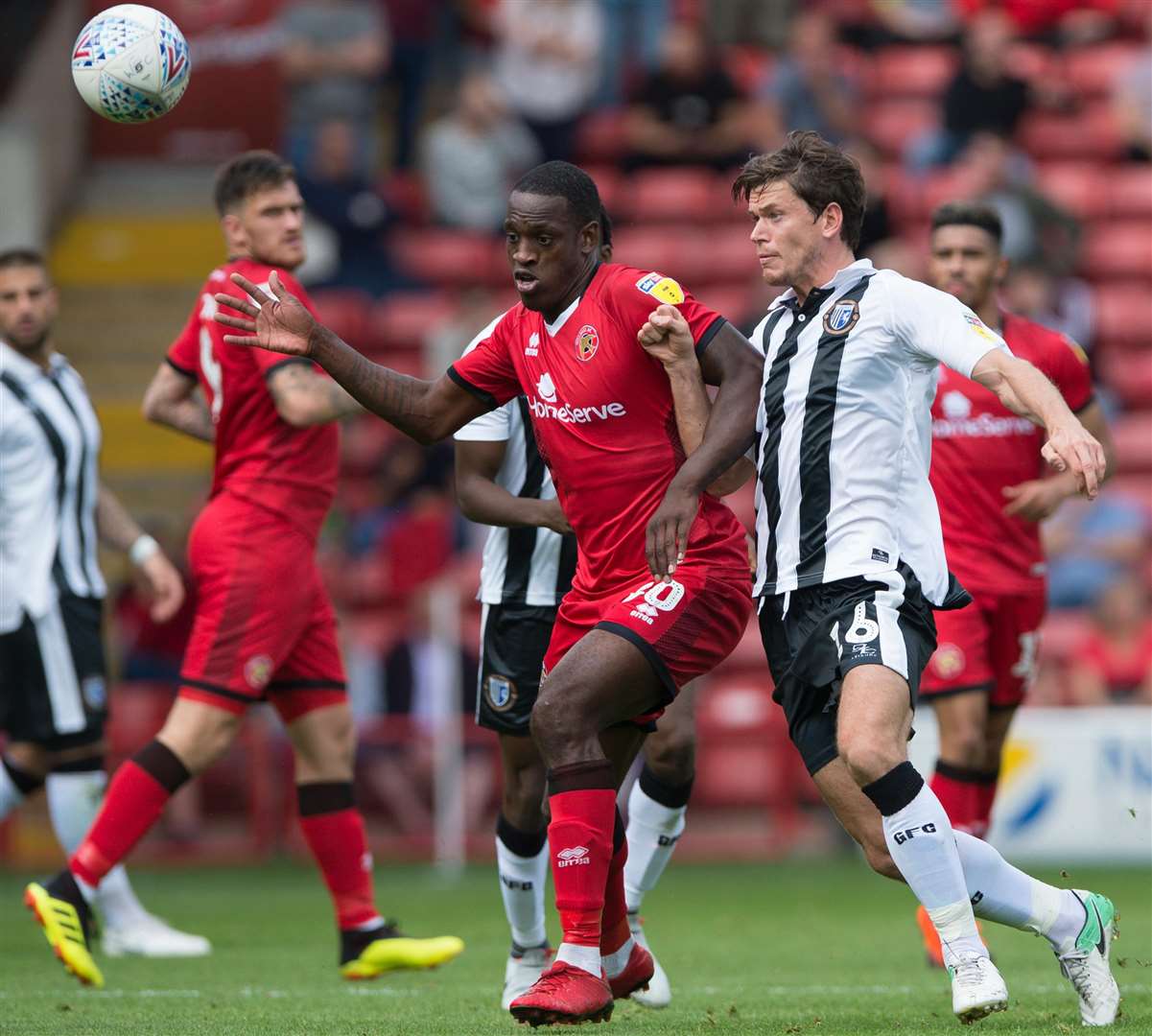 Gillingham's Billy Bingham challenges with Walsall's Isaiah Osbourne Picture: Ady Kerry
