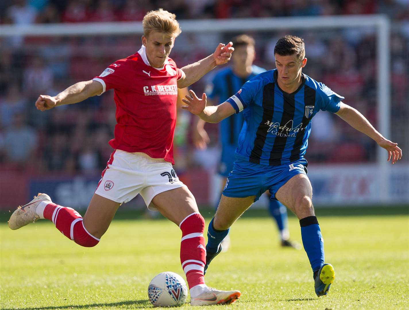 Gillingham's Callum Reilly looks to close down Brad Potts. Picture: Ady Kerry