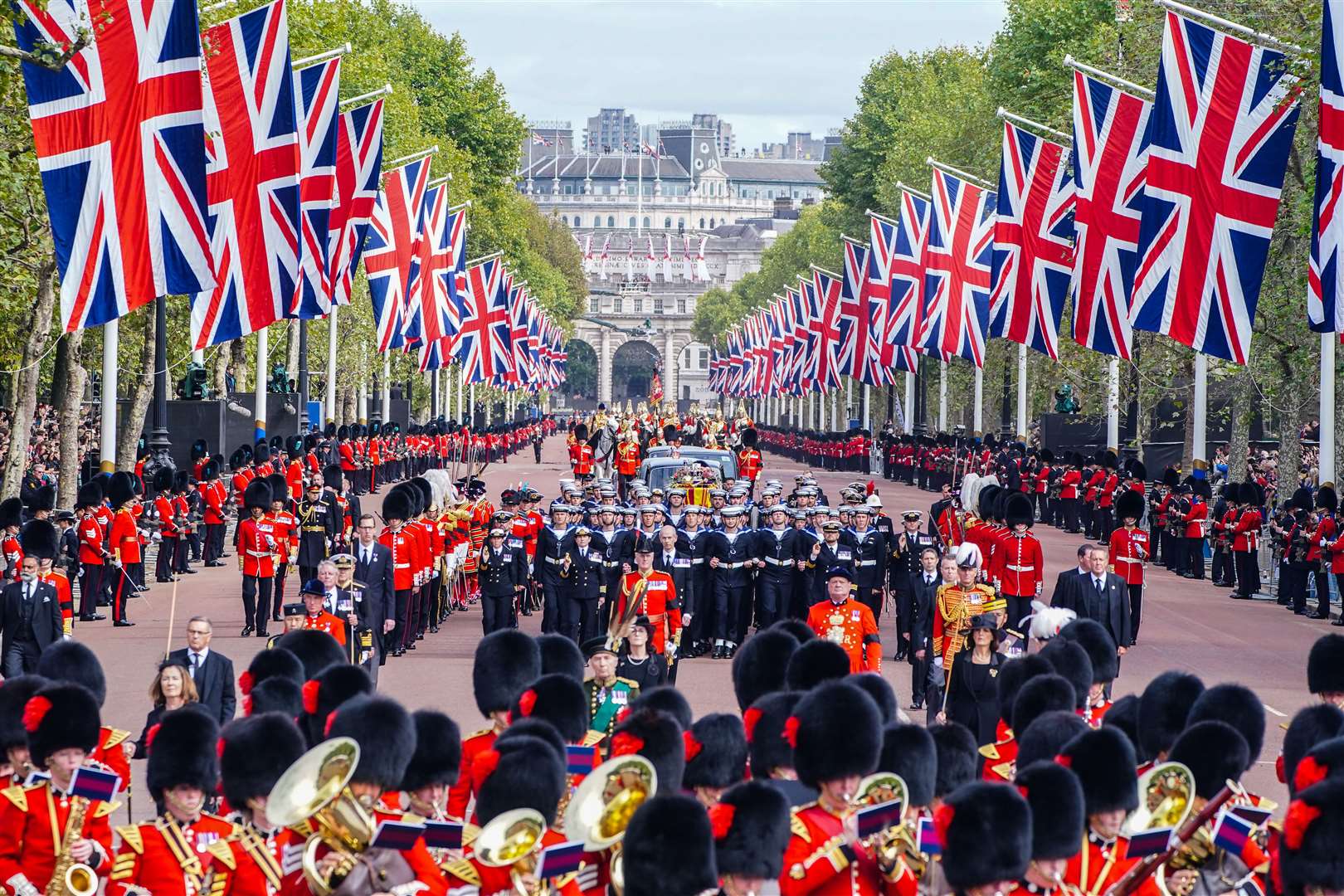 The State Gun Carriage carries the coffin of Queen Elizabeth II, draped in the Royal Standard with the Imperial State Crown and the Sovereign's orb and sceptre, in the Ceremonial Procession following her State Funeral at Westminster Abbey, London. Picture: PA